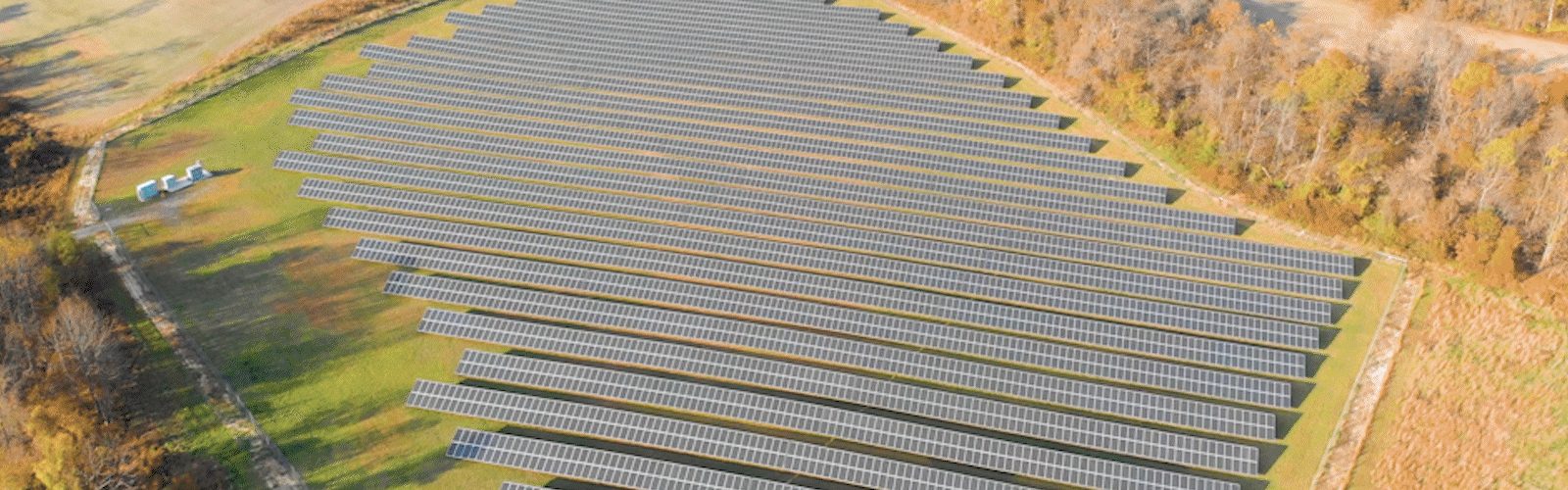 Flyover view of a solar farm and green fields with popup text boxes highlighting Nautilus Solar’s impact: 40,000+ subscribers, over 250 projects in 11 states, over 377 MWh of energy produced, and 263,000 metric tons of CO2 avoided.